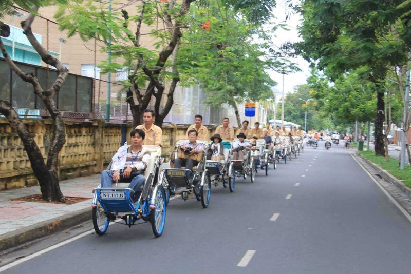 Cyclo Ride on Nha Trang Street Market Cyclo drivers and tourists navigating through busy street markets in Nha Trang