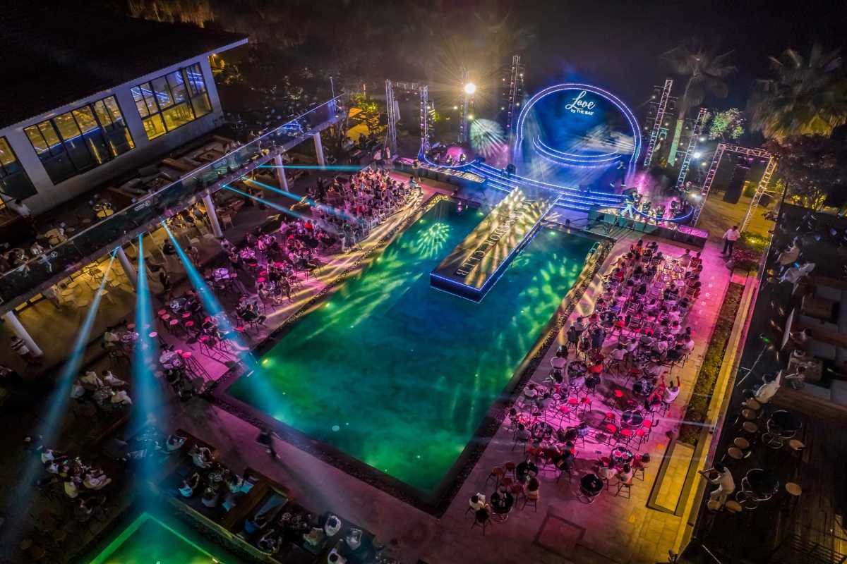Ambassador Club poolside cabaret dinner show with vibrant lighting during the Nha Trang city tour