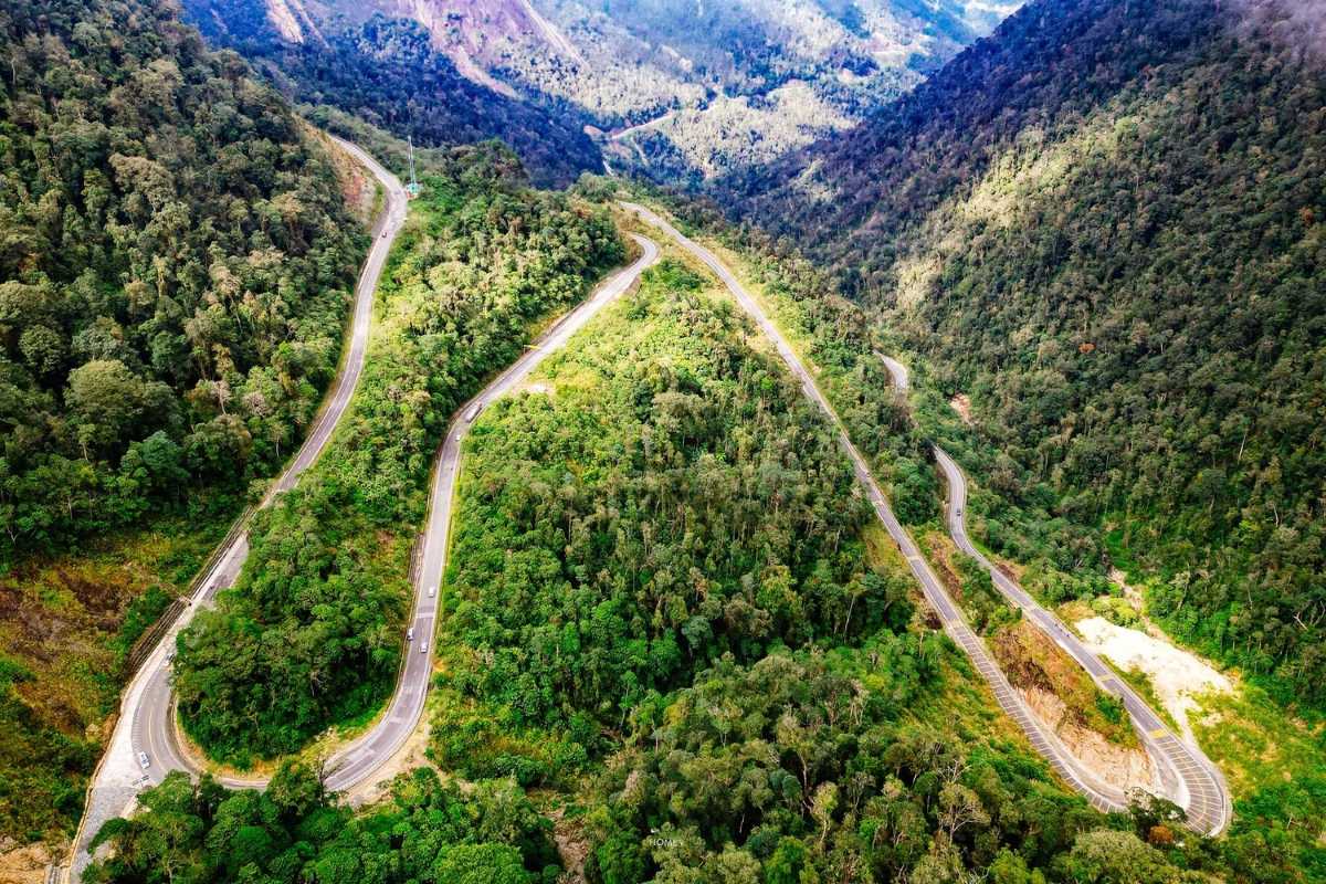 Aerial view of Khanh Le Pass road winding through the jungle-covered mountains on the Nha Trang mountain biking tour.